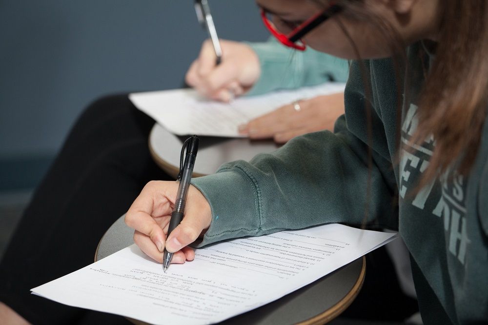 UA stock art of Students working at desks